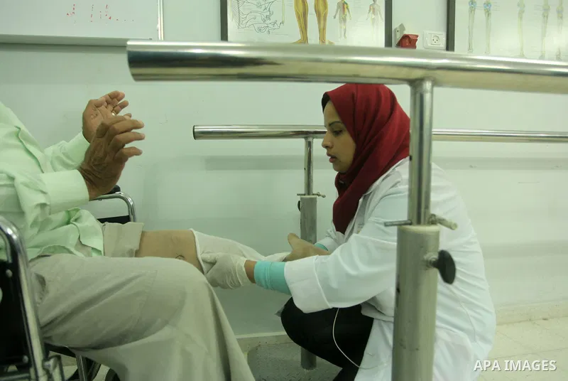 Lana Al-Kronz, 26-year-old Palestinian specialist of prosthetic works on an artificial leg at a center of prosthetic limbs, in Gaza City on April 21, 2015. Al-Krunz is the first Palestinian woman which makes the prosthet...