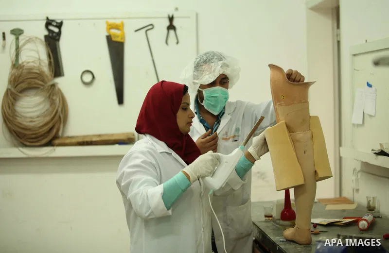 Lana Al-Kronz, 26-year-old Palestinian specialist of prosthetic works on an artificial leg at a center of prosthetic limbs, in Gaza City on April 21, 2015. Al-Krunz is the first Palestinian woman which makes the prosthet...