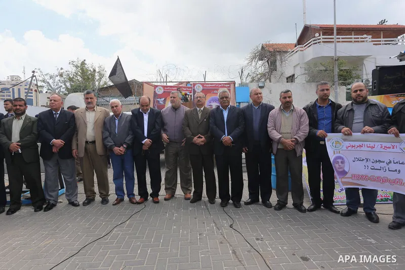 Palestinians take part in a protest to show solidarity with prisoners held in Israeli jails, in front of the headquarter United Nations Development Programme (UNDP), in Gaza city, on April 23, 2015. Photo by Mohammed Asa...