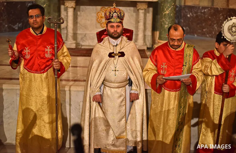 Egyptian Coptic Christians celebrate during a commemorate the 100th anniversary of the 1915 Armenian genocide at the Coptic Orthodox Church in Cairo on April 24, 2015. Historians estimate up to 1.5 million Armenians were...