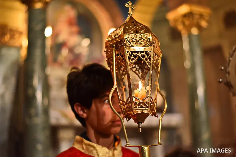 Egyptian Coptic Christians celebrate during a commemorate the 100th anniversary of the 1915 Armenian genocide at the Coptic Orthodox Church in Cairo on April 24, 2015. Historians estimate up to 1.5 million Armenians were...