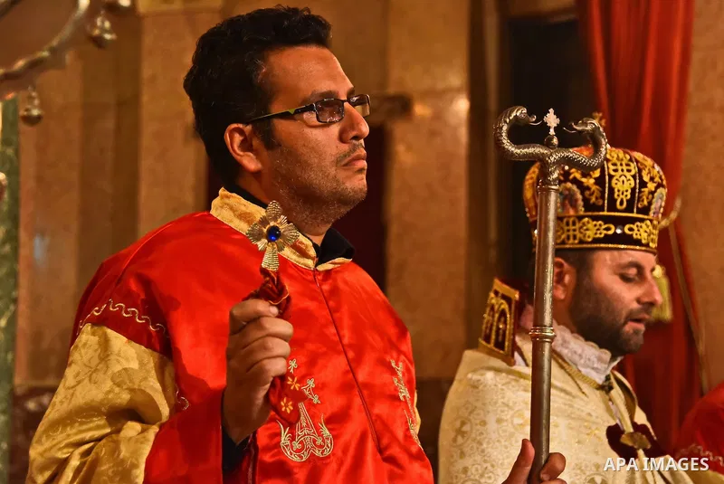 Egyptian Coptic Christians celebrate during a commemorate the 100th anniversary of the 1915 Armenian genocide at the Coptic Orthodox Church in Cairo on April 24, 2015. Historians estimate up to 1.5 million Armenians were...