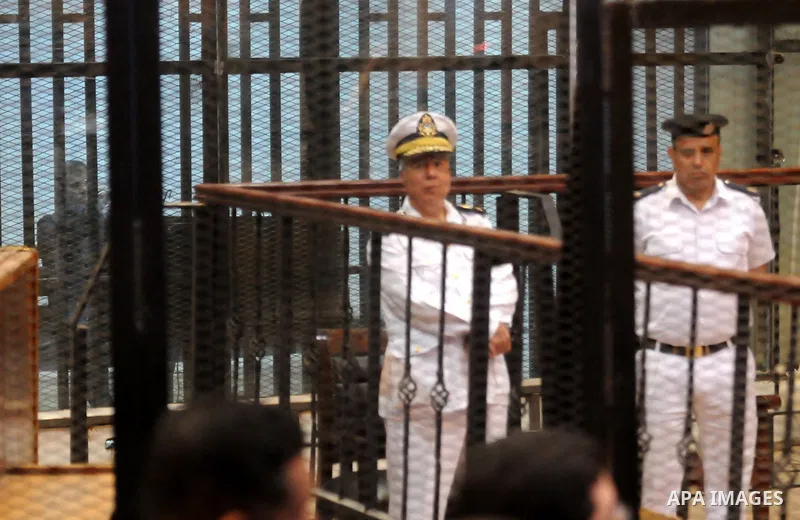 Egyptian President, Mohammad Morsi, stands behind bars as his trial on charges of espionage continues, Cairo, Egypt, 28 April 2015. Morsi has been charged along with several others of leaking classified documents while P...