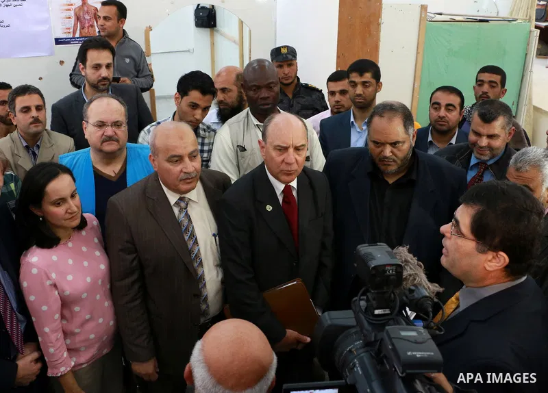 James Rawley, United Nations' humanitarian coordinator for the Palestinian territories, visits the temporary homes of Palestinian who lost their houses during the 50-day Israeli war in the summer of 2014, east of Khan Yo...