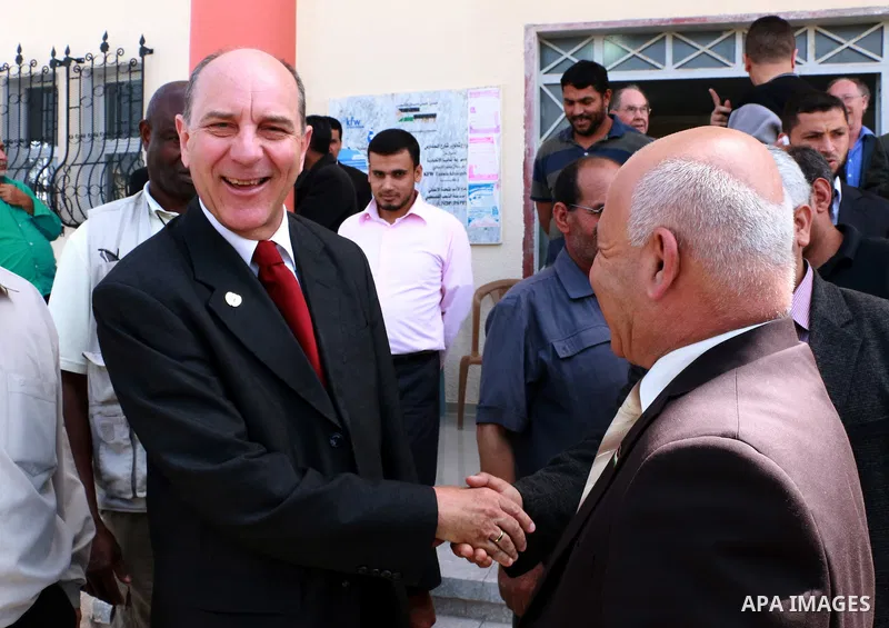 James Rawley, United Nations' humanitarian coordinator for the Palestinian territories, visits the temporary homes of Palestinian who lost their houses during the 50-day Israeli war in the summer of 2014, east of Khan Yo...