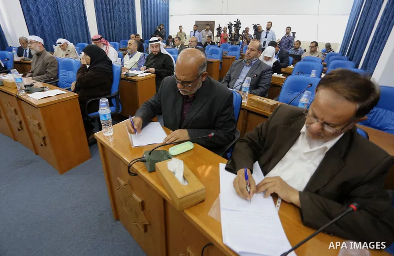 Members of the Palestinian legislative council from Hamas movement attend a meeting at the legislative council in Gaza city on April 29, 2015. Photo by Mohammed Asad