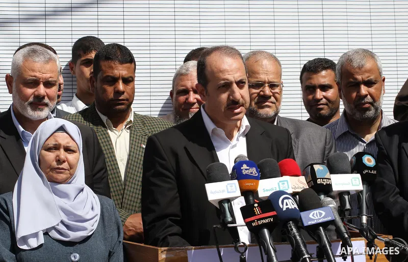Official of the Refugee Affairs Department, Essam Edwan speaks press confernce, as Palestinian officials gather to sign a symbolic document against Israel's settlements and separation barrier in the Palestinian Authority...