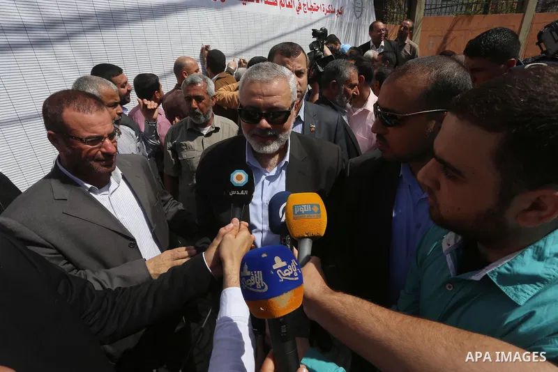 Palestinian Hamas leader Ismail Haniya attends a gathering to sign a symbolic document against Israel's settlements and separation barrier in the Palestinian Authority-controlled West Bank, on April 29, 2015 in Gaza City...
