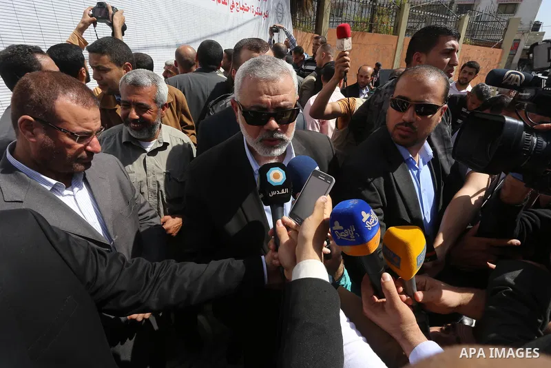 Palestinian Hamas leader Ismail Haniya attends a gathering to sign a symbolic document against Israel's settlements and separation barrier in the Palestinian Authority-controlled West Bank, on April 29, 2015 in Gaza City...