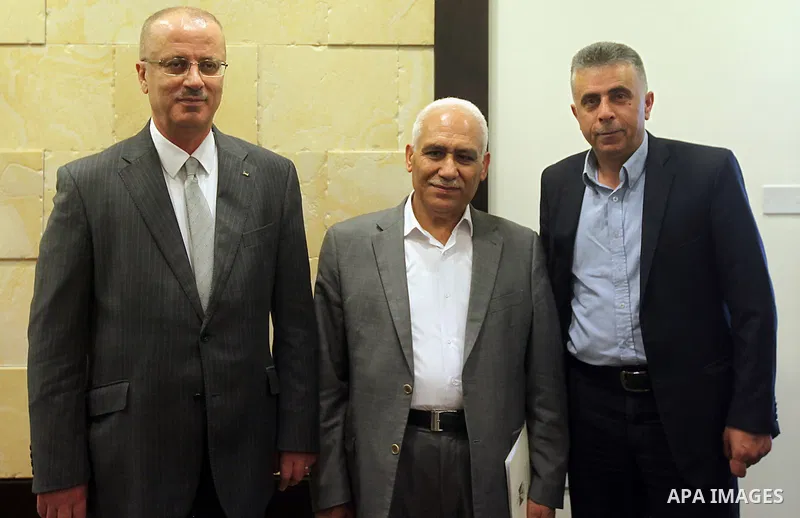 Palestinian Prime Minister Rami Hamdallah meets with Rabi El-Gamal family, in the West Bank city of Ramallah, April 29, 2015. Photo by Prime Minister Office