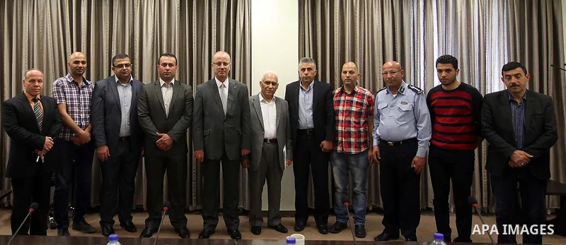 Palestinian Prime Minister Rami Hamdallah meets with Rabi El-Gamal family, in the West Bank city of Ramallah, April 29, 2015. Photo by Prime Minister Office