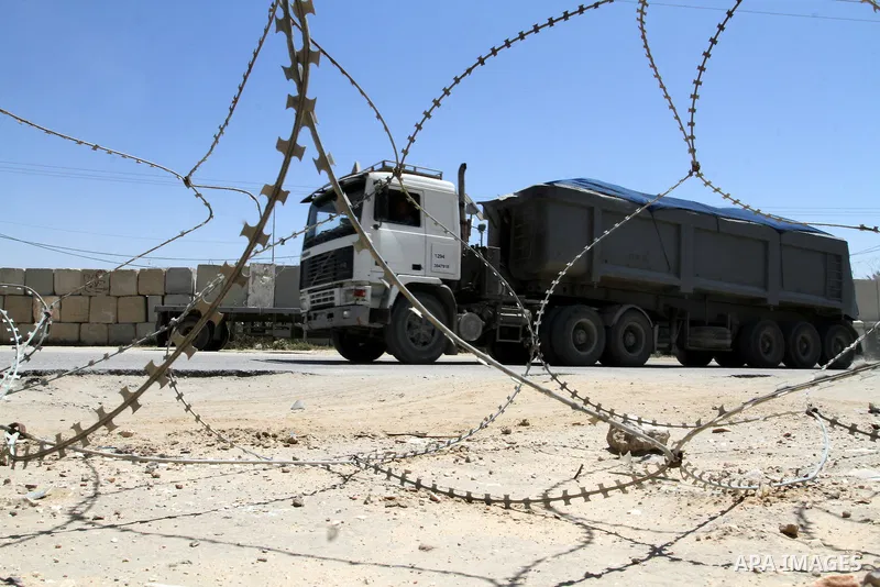 A truck carrying building materials is seen after it entered the southern Gaza Strip from Israel through the Kerem Shalom crossing in Rafah on April 29, 2015. Photo by Abed Rahim Khatib