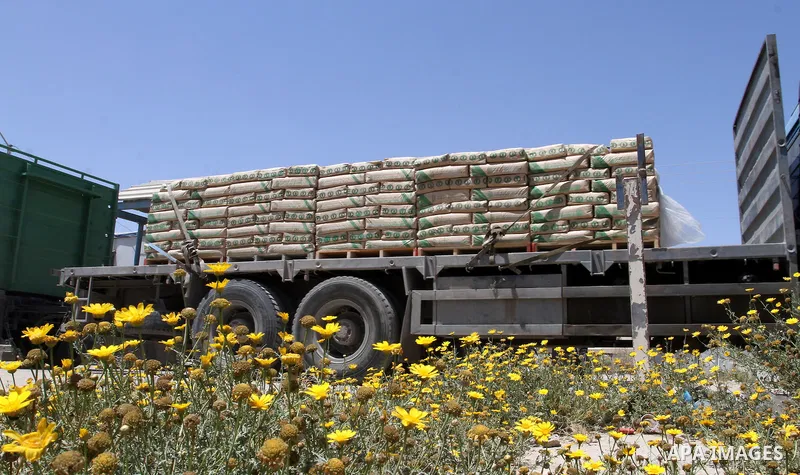 A truck carrying cement is seen after it entered the southern Gaza Strip from Israel through the Kerem Shalom crossing in Rafah on April 29, 2015. Photo by Abed Rahim Khatib