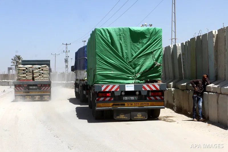 A truck carrying cement is seen after it entered the southern Gaza Strip from Israel through the Kerem Shalom crossing in Rafah on April 29, 2015. Photo by Abed Rahim Khatib