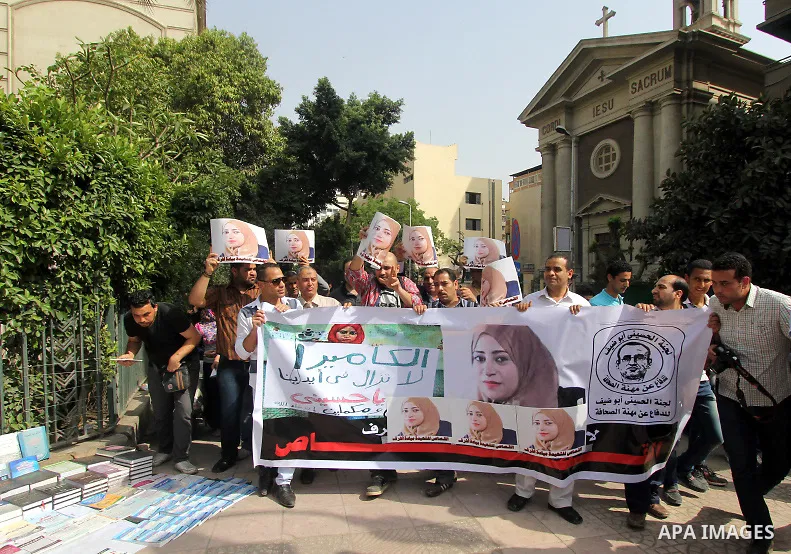 Egyptian Journalists hold pictures of thier fellow Mayada Ashraf, who was killed by Egyptian police,during a protest in Cairo on April 29, 2015. Photo by Amr Sayed