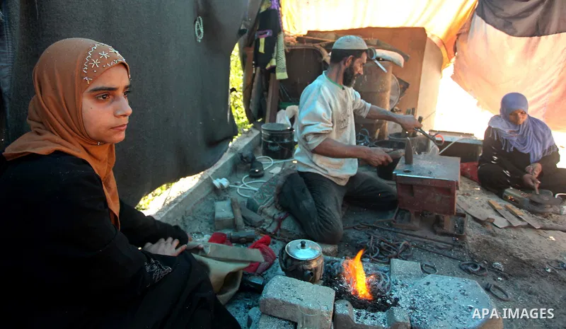 Palestinian blacksmith Ibraheem Mustafa, 40-year-old, hammers heated steel, at his small workshop in Gaza city on April 30, 2015. The ILO estimates that the 2014 conflict in Gaza raised unemployment from 32.6 per cent to...