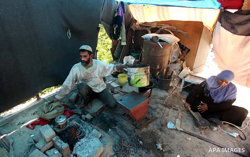 Palestinian blacksmith Ibraheem Mustafa, 40-year-old, melts a steel bar, at his small workshop in Gaza city on April 30, 2015. The ILO estimates that the 2014 conflict in Gaza raised unemployment from 32.6 per cent to 36...