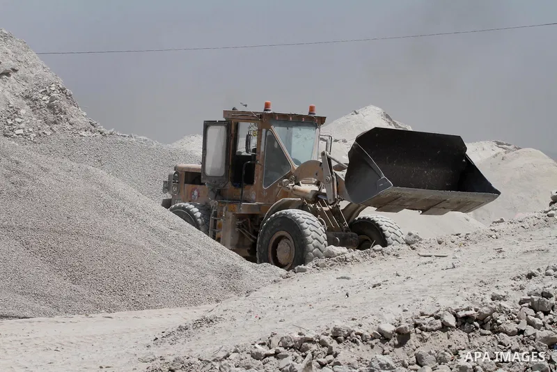 Palestinian workers crush stones and cement blocks from houses destroyed by Israeli shelling during the 50-day Israeli war in the summer of 2014, in the eastern Gaza City neighborhood of Shejaiya on April 30, 2015. The I...