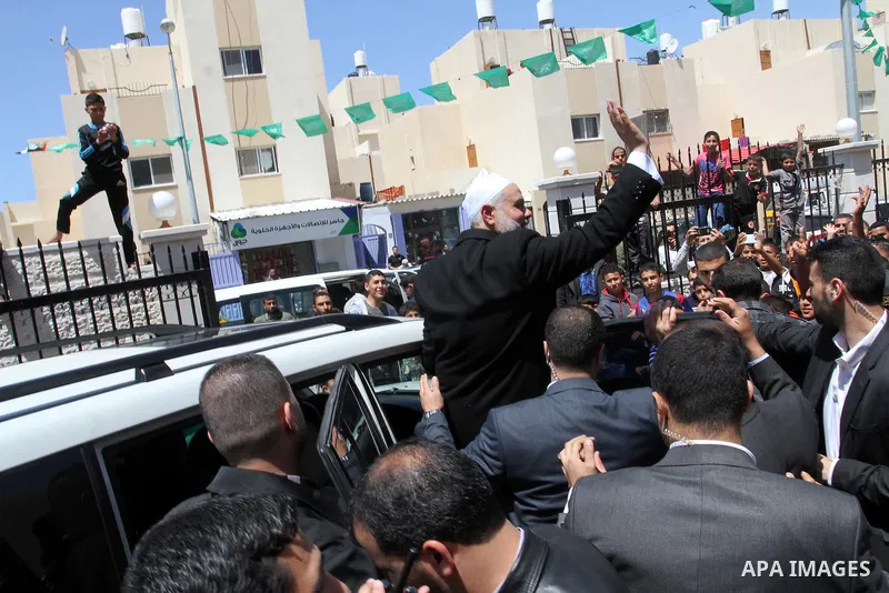 Senior Hamas leader Ismail Haniyeh, waves after giving a speech during Friday prayers in the southern Gaza Strip town of Rafah on May 1, 2015. Photo by Abed Rahim Khatib