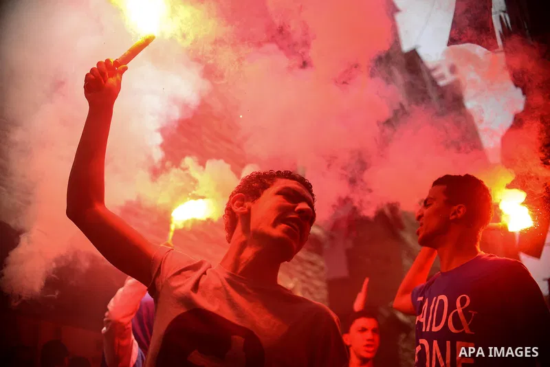 Egyptian supporters of Muslim Brotherhood and ousted president Mohammed Morsi, lights flares during a protest against military rule in al-Matariya district, near Cairo on May 1, 2015. Photo by Amr Sayed