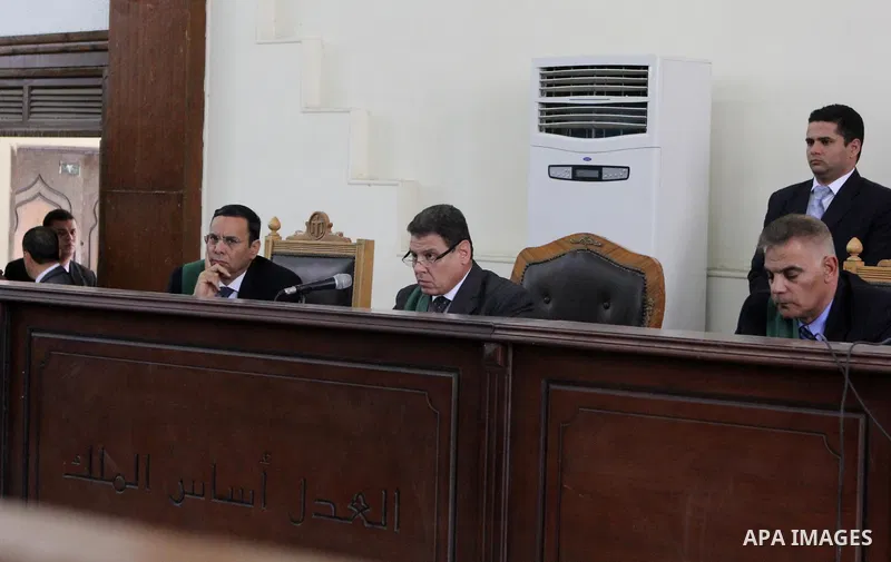 Egyptian Judges attend the trial of Egyptian radical Islamist Mohammed al-Zawahiri, the brother of Al-Qaeda chief Ayman al-Zawahiri with 68 other defendants in Cairo on May 02, 2015. Photo by Amr Sayed