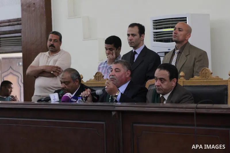 The Judge speaks during the trial of Ansar Bait Al-Maqdis group, in a court in Cairo on May 3, 2015. Cairo criminal court Sunday adjourned the trial of 213 suspects of Ansar Bait Al-Maqdis group, on charges of assassinat...