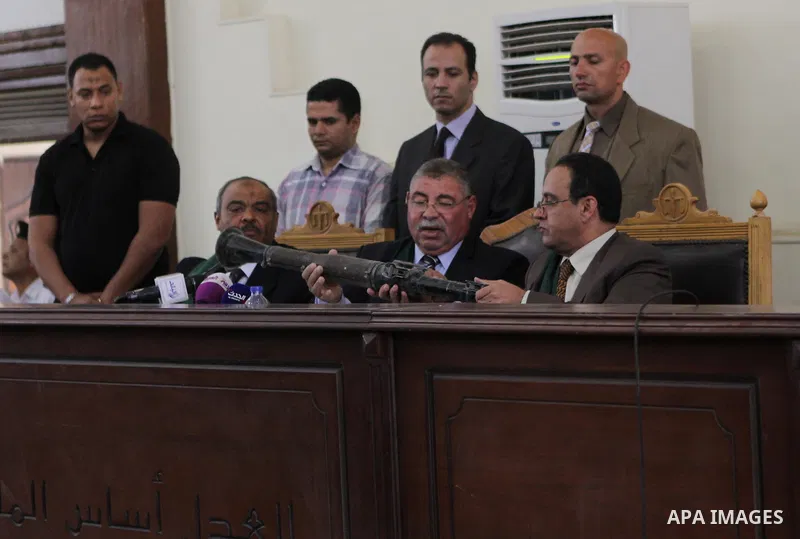 The Judge displays the weapons used by Ansar Bait Al-Maqdis group, during their trial in Cairo on May 3, 2015. Cairo criminal court Sunday adjourned the trial of 213 suspects of Ansar Bait Al-Maqdis group, on charges of...