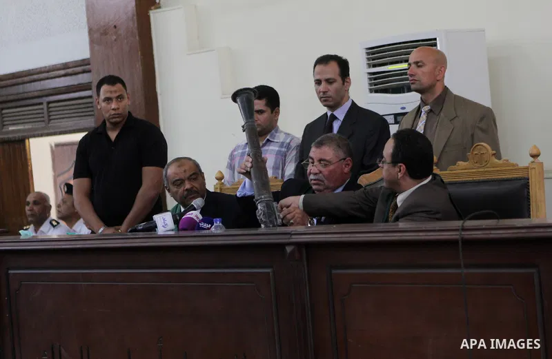 The Judge displays the weapons used by Ansar Bait Al-Maqdis group, during their trial in Cairo on May 3, 2015. Cairo criminal court Sunday adjourned the trial of 213 suspects of Ansar Bait Al-Maqdis group, on charges of...