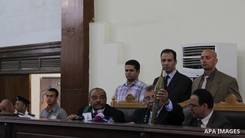 The Judge displays the weapons used by Ansar Bait Al-Maqdis group, during their trial in Cairo on May 3, 2015. Cairo criminal court Sunday adjourned the trial of 213 suspects of Ansar Bait Al-Maqdis group, on charges of...