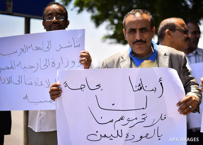 Yemeni expatriates hold banners during a protest demanding the return to Yemen, outside the Yemeni embassy, in Cairo on May 3, 2015. Between 40-50 Arab special forces soldiers arrived in Aden on Sunday and deployed along...