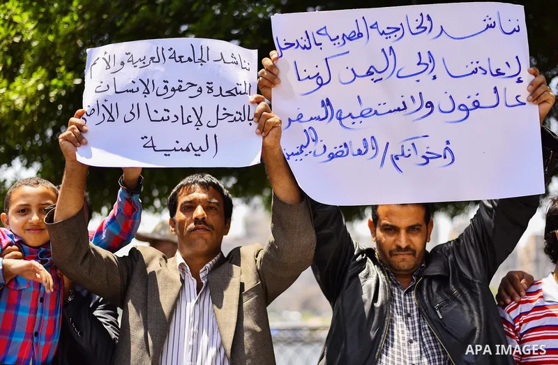 Yemeni expatriates hold banners during a protest demanding the return to Yemen, outside the Yemeni embassy, in Cairo on May 3, 2015. Between 40-50 Arab special forces soldiers arrived in Aden on Sunday and deployed along...