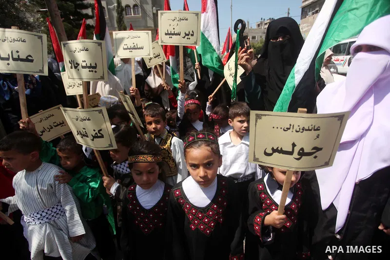 Palestinian children take part in a demonstration ahead of the commemorations of the 67th anniversary of the "Nakba", in front of the office of the High Commissioner for Human Rights in Gaza City on May 6, 2015. "Nakba"...