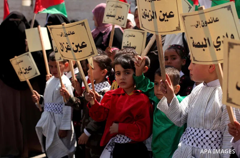Palestinian children take part in a demonstration ahead of the commemorations of the 67th anniversary of the "Nakba", in front of the office of the High Commissioner for Human Rights in Gaza City on May 6, 2015. "Nakba"...