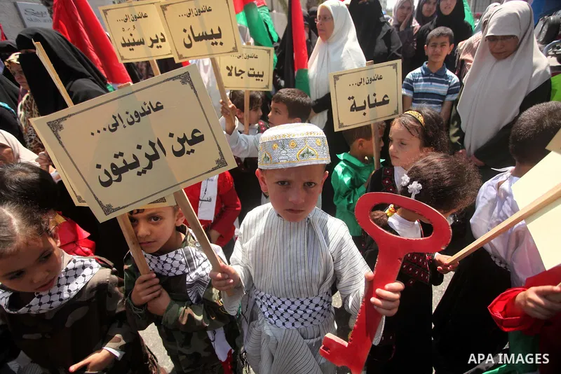 Palestinian children take part in a demonstration ahead of the commemorations of the 67th anniversary of the "Nakba", in front of the office of the High Commissioner for Human Rights in Gaza City on May 6, 2015. "Nakba"...