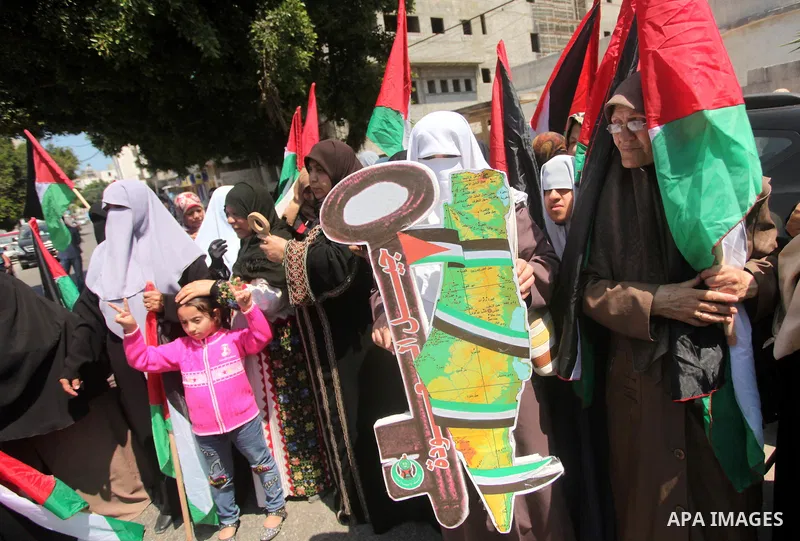 Palestinian women, supporters of the Hamas movement, take part in a demonstration ahead of the commemorations of the 67th anniversary of the "Nakba", in front of the office of the High Commissioner for Human Rights in Ga...