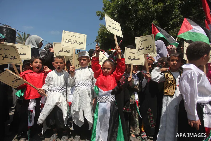 Palestinian children take part in a demonstration ahead of the commemorations of the 67th anniversary of the "Nakba", in front of the office of the High Commissioner for Human Rights in Gaza City on May 6, 2015. "Nakba"...