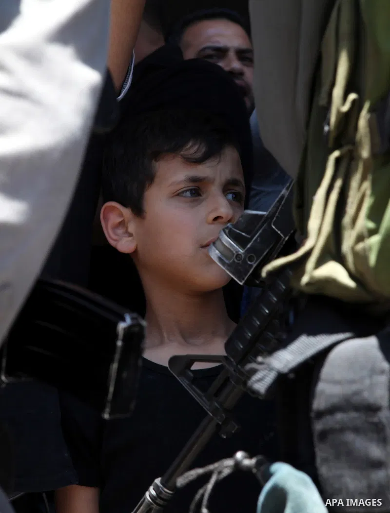 Palestinian protesters from the East Jerusalem village of al-Zaim, wave Palestinian flags as they confront Israeli Border Police during a protest demanding the opening of the only gate in the separated barrier leading fr...