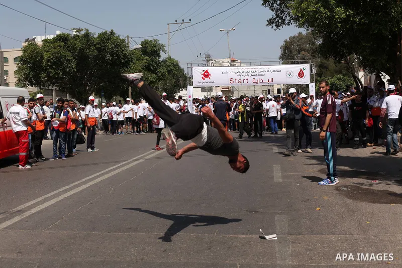 Palestinians take part in a marathon to mark the International Thalassemia Day Gaza city, May 9, 2015. Thalassemia is a genetic disease of the blood that patients cannot produce enough hemoglobin, the substance in red bl...