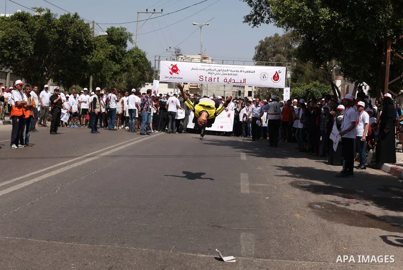 Palestinians take part in a marathon to mark the International Thalassemia Day Gaza city, May 9, 2015. Thalassemia is a genetic disease of the blood that patients cannot produce enough hemoglobin, the substance in red bl...