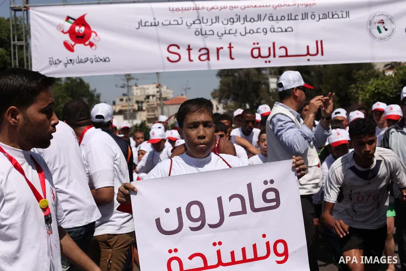 Palestinians take part in a rally to mark the International Thalassemia Day Gaza city, May 9, 2015. Thalassemia is a genetic disease of the blood that patients cannot produce enough hemoglobin, the substance in red blood...