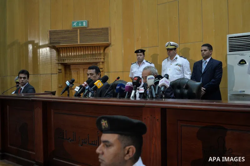 Egyptian Judge Hassan Hassanin speaks to media during the trial of ousted Egyptian President Hosni Mubarak on May 9, 2015 in the capital Cairo. The Egyptian court sentenced Mubarak and his two sons to three years in pris...