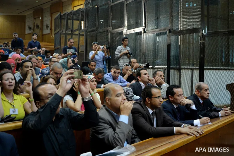Supporters of Egypt's former president Hosni Mubarak, cry after his verdict hearing in a retrial for embezzlement on May 9, 2015 in the capital Cairo. The Egyptian court sentenced Mubarak and his two sons to three years...