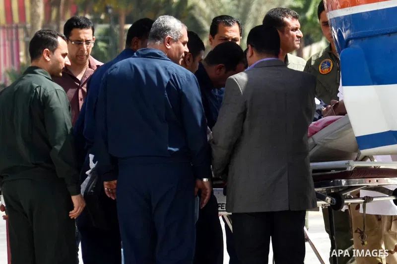 Egypt's former president Hosni Mubarak lies on a stretcher on the way to Maadi military hospital after his verdict hearing in a retrial for embezzlement on May 9, 2015 in the capital Cairo. The Egyptian court sentenced M...