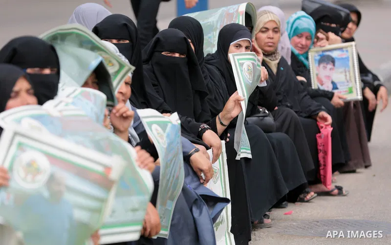 Palestinian families of martyrs take part a protest to demand their rights, in front of the headquarters of the Council of Ministers in Gaza city, on May 12, 2015. Photo by Yasser Qudih