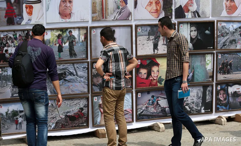 Palestinians take part in a photo exhibition ahead of the commemorations of the 67th anniversary of the ''Nakba'', in Gaza city on May 12, 2015. ''Nakba'' means in Arabic ''catastrophe'' in reference to the birth of the...