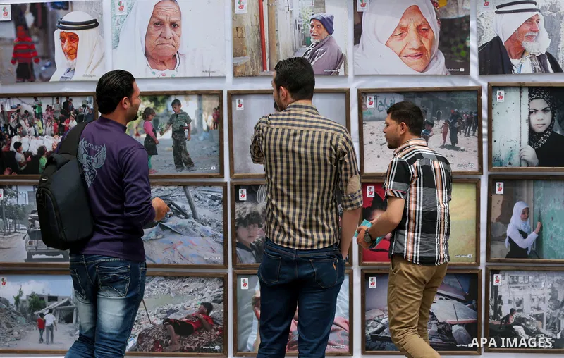 Palestinians take part in a photo exhibition ahead of the commemorations of the 67th anniversary of the ''Nakba'', in Gaza city on May 12, 2015. ''Nakba'' means in Arabic ''catastrophe'' in reference to the birth of the...