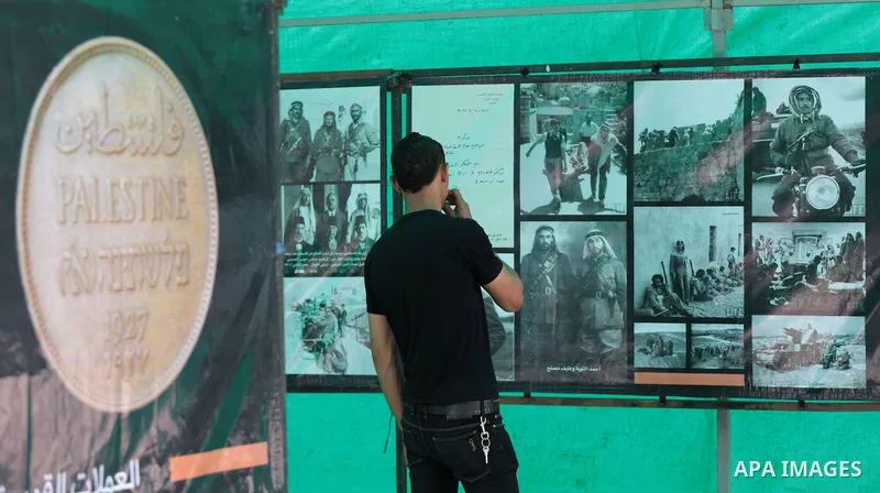 Palestinians take part in a photo exhibition ahead of the commemorations of the 67th anniversary of the ''Nakba'', in Gaza city on May 12, 2015. ''Nakba'' means in Arabic ''catastrophe'' in reference to the birth of the...