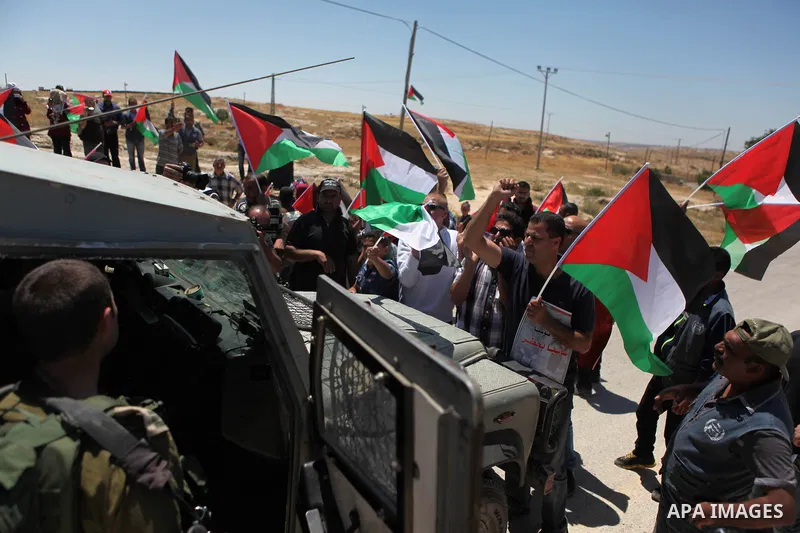 Palestinian activities and Foreign take part a protest against an Israeli decision to demolish the village of Susia outside the West Bank village of Yatta in southern of Hebron, on May 16, 2015. Palestinians are not allo...