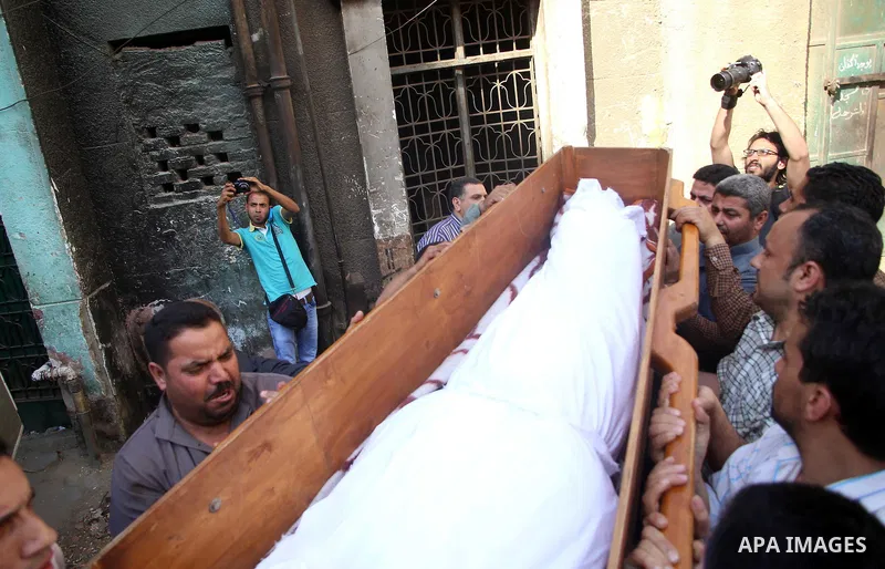 Relatives carry the coffin of an executed member of Ansar Beit al-Maqdis, outside a morgue in Cairo on May 17, 2015. Egypt executed six men Sunday convicted of belonging to the Sinai-based militant group Ansar Beit al-Ma...