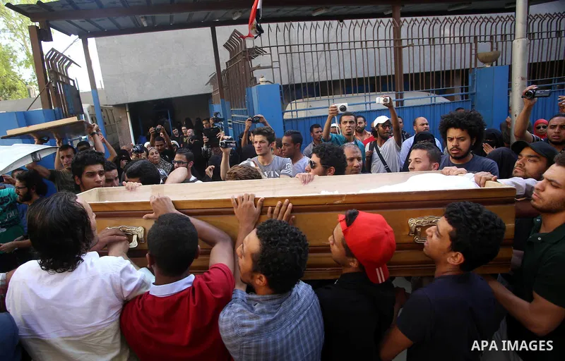 Relatives carry the coffin of an executed member of Ansar Beit al-Maqdis, outside a morgue in Cairo on May 17, 2015. Egypt executed six men Sunday convicted of belonging to the Sinai-based militant group Ansar Beit al-Ma...